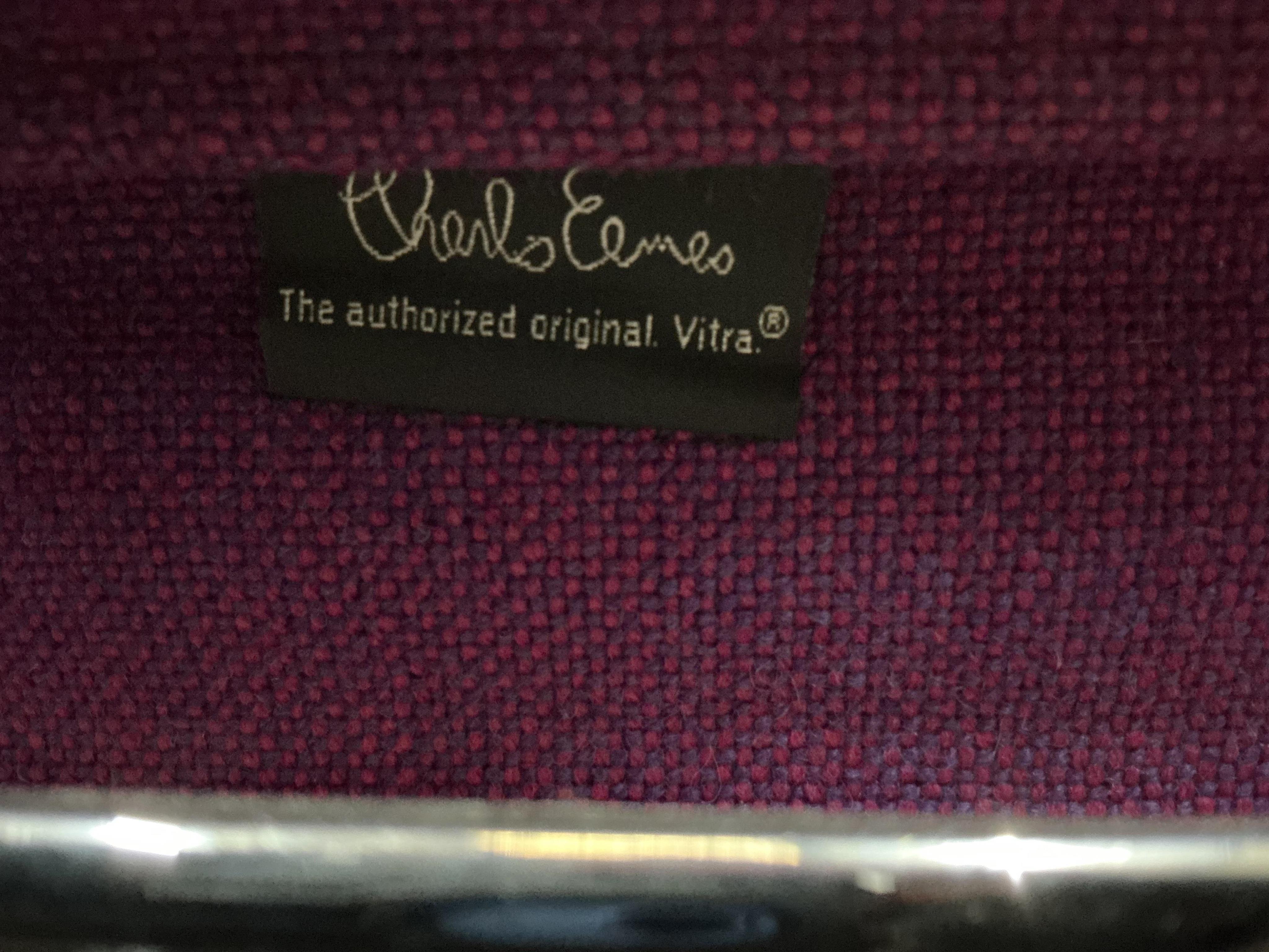 Charles Eames for Vitra, a pair of chrome swivel desk chairs on four prong bases, width 57cm, depth 50cm, height 82cm